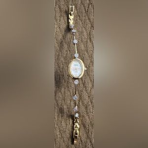 Ladies Armitron watch with diamonds on the band and Mother of Pearl face
